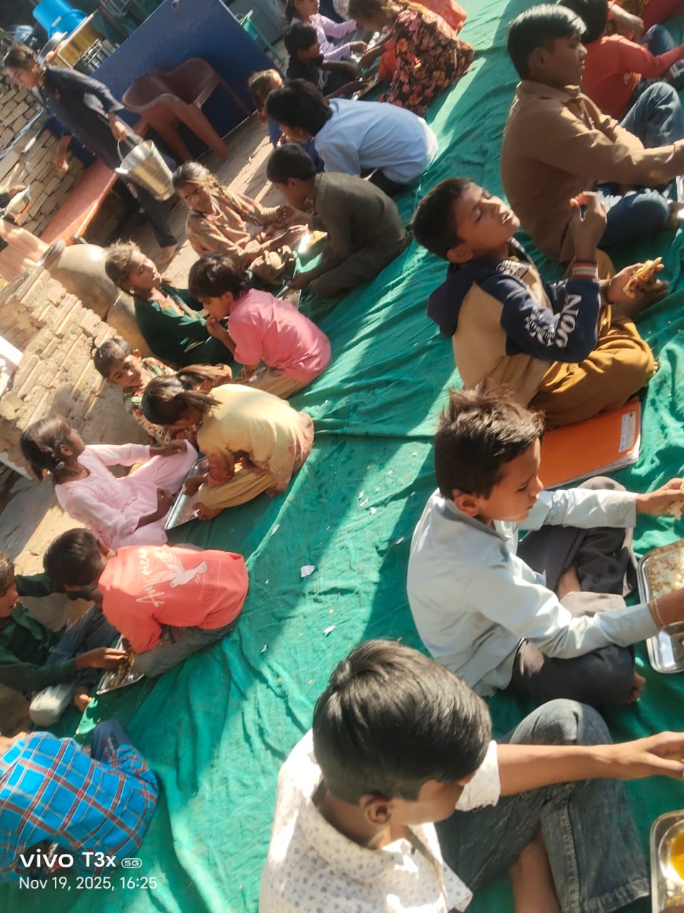 Rescued Hindu orphans receiving food